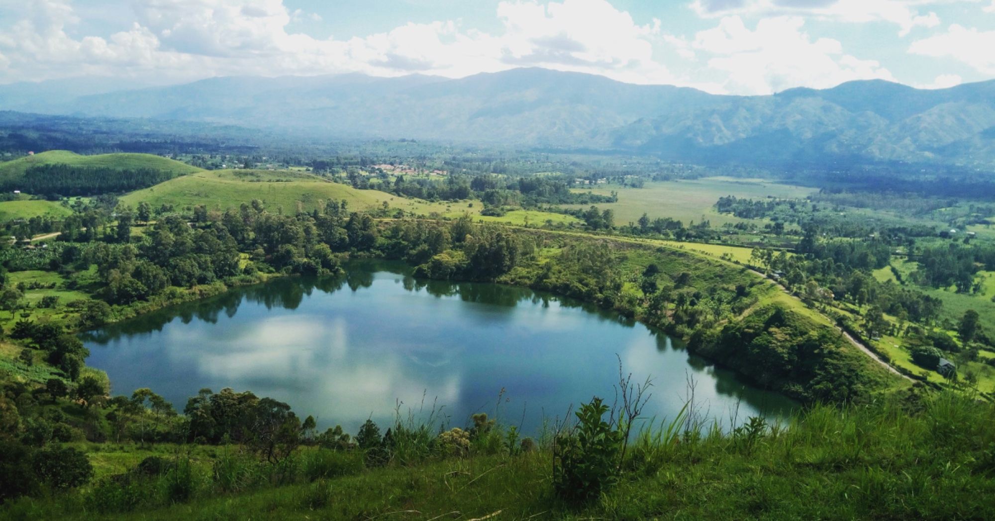 Uganda landscape — green hills, lake, and villages of Serere District